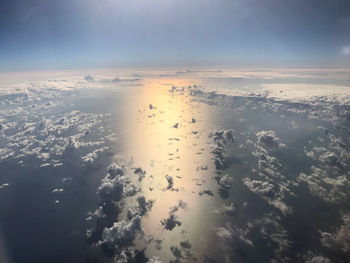 Aerial view of clouds over sea against sky