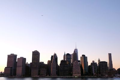 Skyscrapers in city against clear sky