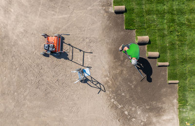 High angle view of people on sand at beach