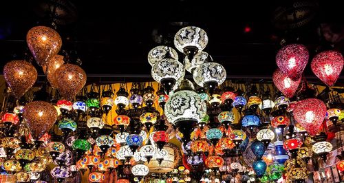 Low angle view of lanterns hanging at night