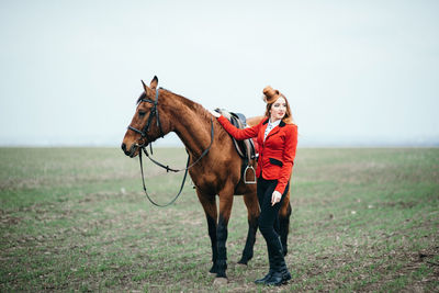 Man riding horse on field