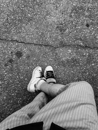 Low section of man standing on footpath