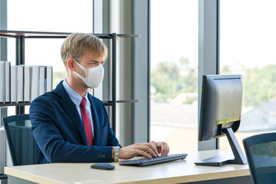 Man using laptop on table