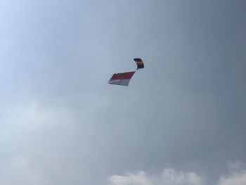 Low angle view of kite flying against sky