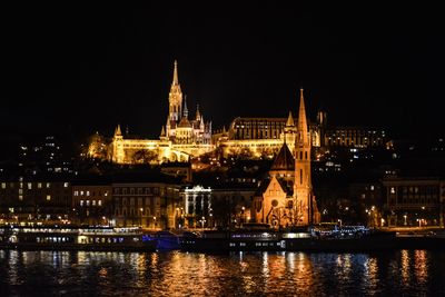 Illuminated buildings at waterfront