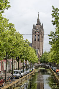 Bridge over river amidst buildings in city