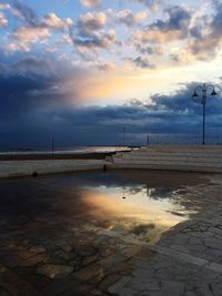 Scenic view of beach against sky during sunset