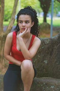 Teenage girl sitting at park