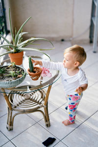 Cute girl looking down on table