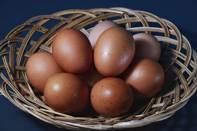 High angle view of eggs in basket on table