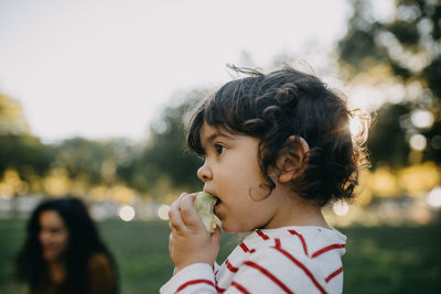 Close-up portrait of girl eating food