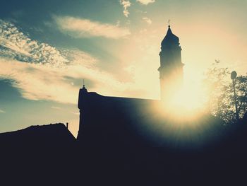 Silhouette of building at sunset