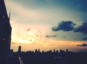 Silhouette of city during sunset