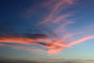 Low angle view of cloudy sky at sunset