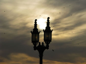 Low angle view of silhouette bird against sky