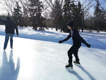 Full length of man walking on snow field