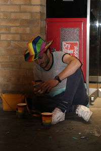 Man sitting on floor at home