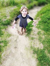 Full length of a girl playing in water