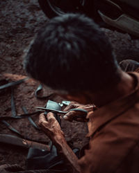 High angle view of man using mobile phone