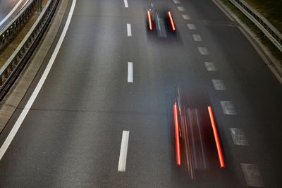 High angle view of light trails on road