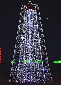 Low angle view of illuminated building at night