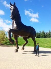 Horse on landscape against sky