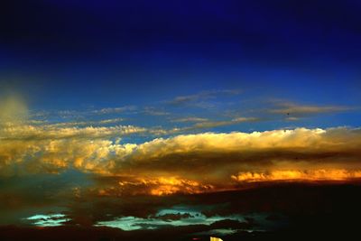 Scenic view of clouds in sky at sunset