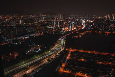 Aerial view of illuminated cityscape at night