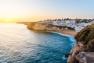 Panoramic view of sea against clear sky during sunset