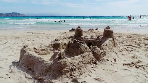 Scenic view of beach against sky