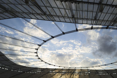 Low angle view of modern buildings against sky.  from inside a football stadium.