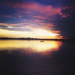 Scenic view of sea against dramatic sky