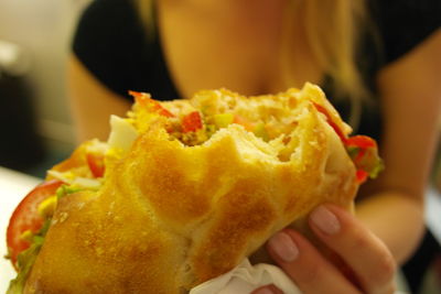 Close-up of hand holding ice cream
