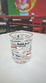 High angle view of text on glass table
