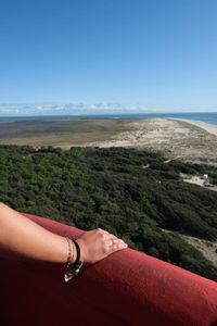 Man on beach against clear sky