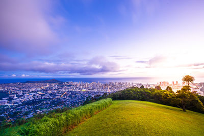 Aerial view of cityscape against sky during sunset