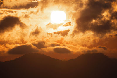 Scenic view of dramatic sky during sunset