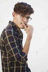 Portrait of young man standing outdoors