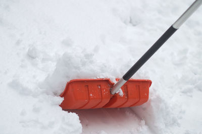 Close-up of snow spade in winter 