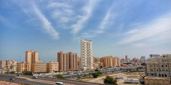 Buildings in city against sky