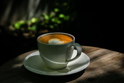 Close-up of coffee cup on table