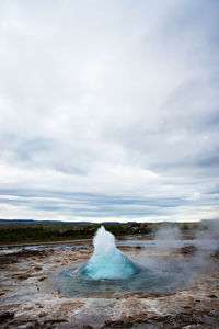 The great geysir, geyser in southwestern iceland, haukadalur valley, geyser splashing out of ground 