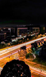 High angle view of light trails on city street at night