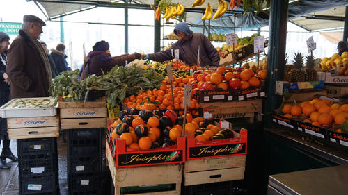 People at market stall