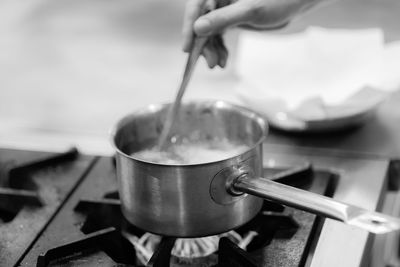 Close-up of person preparing food in kitchen