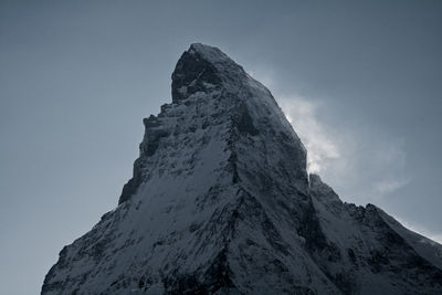 Low angle view of mountain against clear sky