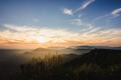 Scenic view of mountains against sky during sunset