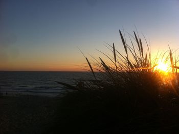 Scenic view of sea against sky at sunset