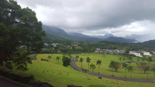 Scenic view of mountains against cloudy sky