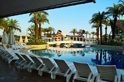Side view of chairs and tables at restaurant